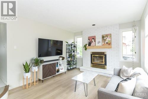 1467 Spartan Grove Street, Ottawa, ON - Indoor Photo Showing Living Room With Fireplace