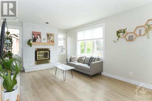 1467 Spartan Grove Street, Ottawa, ON - Indoor Photo Showing Living Room With Fireplace