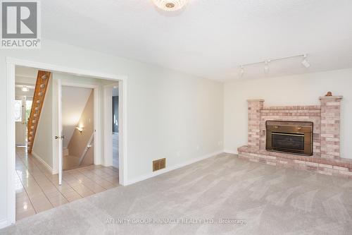 4 Found Avenue, Kawartha Lakes (Lindsay), ON - Indoor Photo Showing Living Room With Fireplace