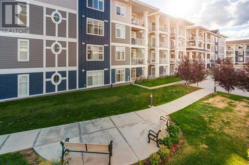 221, 400 Auburn Meadows Common Se, Calgary, AB - Outdoor With Balcony With Facade