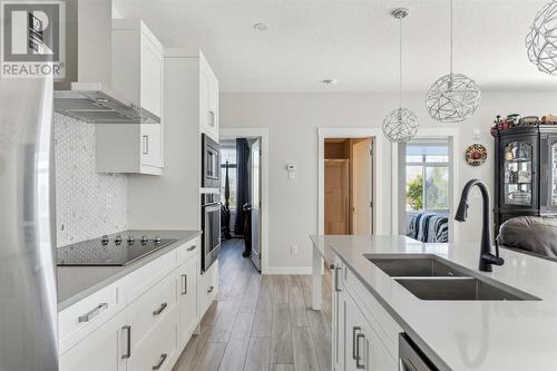 221, 400 Auburn Meadows Common Se, Calgary, AB - Indoor Photo Showing Kitchen With Double Sink With Upgraded Kitchen