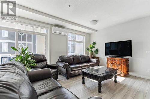 221, 400 Auburn Meadows Common Se, Calgary, AB - Indoor Photo Showing Living Room