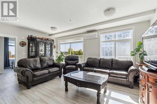 221, 400 Auburn Meadows Common Se, Calgary, AB - Indoor Photo Showing Living Room