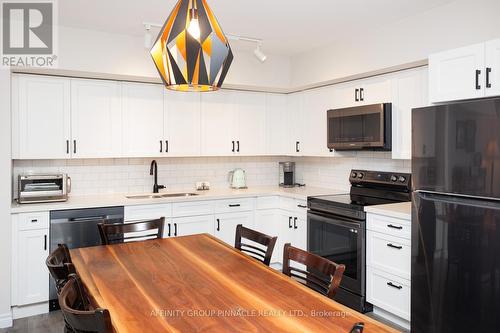 105 - 25 King Street, Kawartha Lakes (Lindsay), ON - Indoor Photo Showing Kitchen With Double Sink