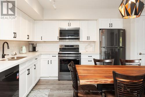 105 - 25 King Street, Kawartha Lakes (Lindsay), ON - Indoor Photo Showing Kitchen With Double Sink