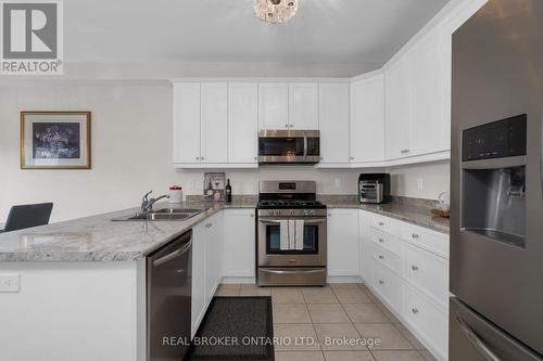 14 Jones Street, New Tecumseth, ON - Indoor Photo Showing Kitchen With Double Sink