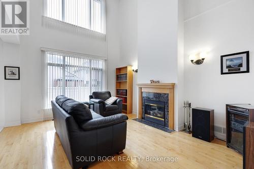 2011 Calico Crescent, Ottawa, ON - Indoor Photo Showing Living Room With Fireplace