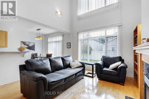 2011 Calico Crescent, Ottawa, ON - Indoor Photo Showing Living Room With Fireplace