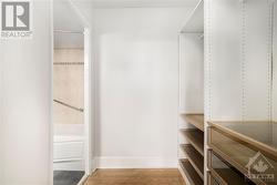 Primary BR walk-in with ample shelving - 