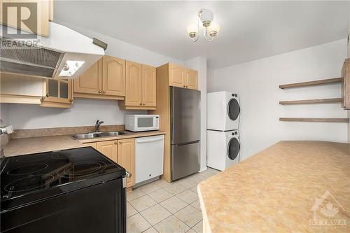 Laundry appliances in kitchen nook - 370 Dominion Avenue Unit#304, Ottawa, ON - Indoor Photo Showing Kitchen With Double Sink