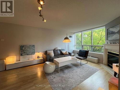 411 - 1 Ripley Avenue, Toronto (High Park-Swansea), ON - Indoor Photo Showing Living Room With Fireplace