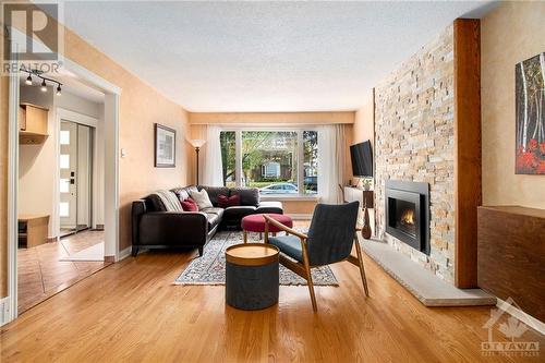 64 Beechmont Crescent, Ottawa, ON - Indoor Photo Showing Living Room With Fireplace