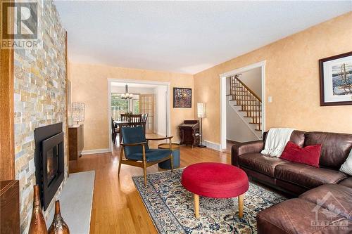 64 Beechmont Crescent, Ottawa, ON - Indoor Photo Showing Living Room With Fireplace