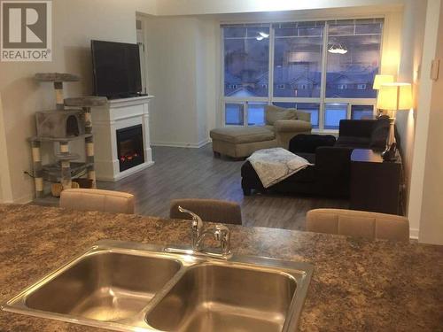 3550 Woodsdale Road Unit# 304, Lake Country, BC - Indoor Photo Showing Kitchen With Fireplace With Double Sink