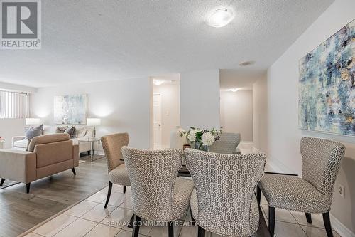 103 - 10 Tapscott Road, Toronto, ON - Indoor Photo Showing Living Room