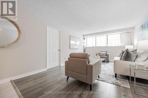 103 - 10 Tapscott Road, Toronto, ON - Indoor Photo Showing Living Room