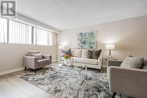 103 - 10 Tapscott Road, Toronto, ON - Indoor Photo Showing Living Room