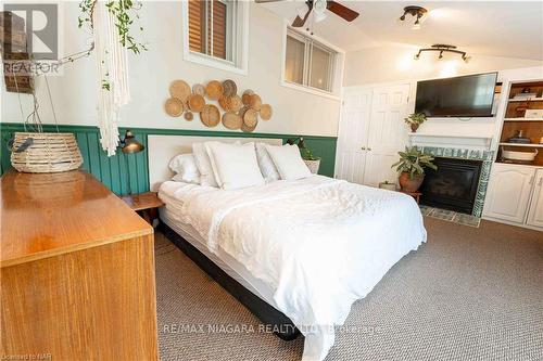 4 Joanna Drive, St. Catharines, ON - Indoor Photo Showing Bedroom With Fireplace