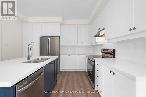 23 Calypso Avenue, Springwater, ON - Indoor Photo Showing Kitchen With Double Sink