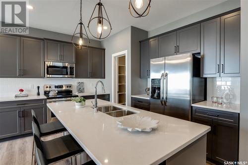 2977 Bellegarde Crescent, Regina, SK - Indoor Photo Showing Kitchen With Double Sink With Upgraded Kitchen