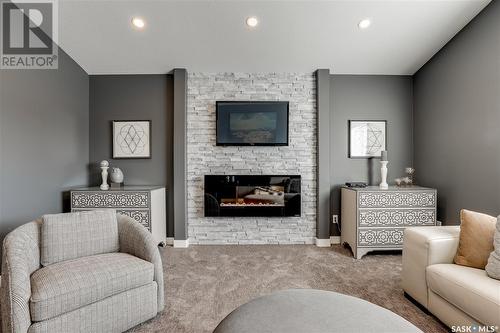 2977 Bellegarde Crescent, Regina, SK - Indoor Photo Showing Living Room With Fireplace