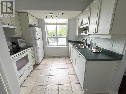 209 - 4640 Kimbermount Avenue, Mississauga, ON - Indoor Photo Showing Kitchen With Double Sink