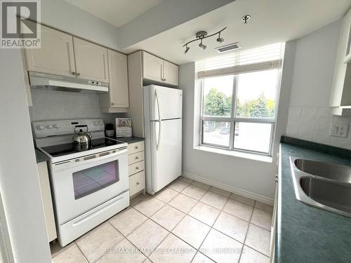 209 - 4640 Kimbermount Avenue, Mississauga, ON - Indoor Photo Showing Kitchen With Double Sink