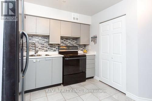 911 - 1485 Lakeshore Road E, Mississauga, ON - Indoor Photo Showing Kitchen With Double Sink