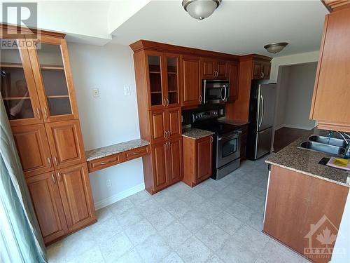 Kitchen w/ computer area - 125 Woodmill Terrace, Ottawa, ON - Indoor Photo Showing Kitchen With Double Sink