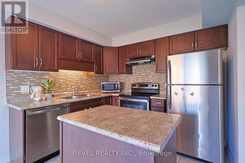 7732 Shaw Street, Niagara Falls, ON - Indoor Photo Showing Kitchen With Double Sink