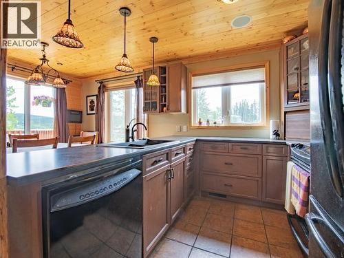 17 Jackson Avenue, Teslin, YT - Indoor Photo Showing Kitchen With Double Sink