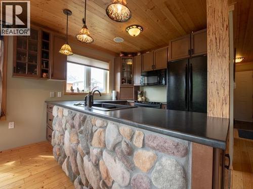 17 Jackson Avenue, Teslin, YT - Indoor Photo Showing Kitchen With Double Sink