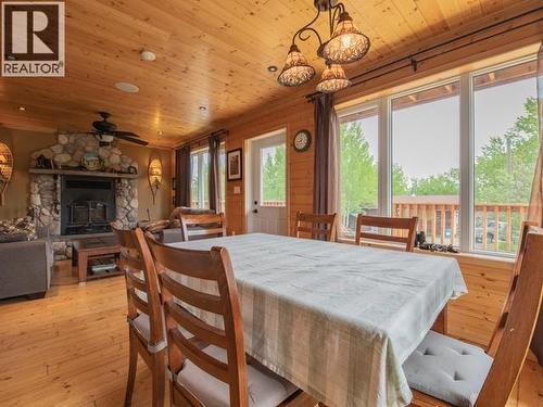 17 Jackson Avenue, Teslin, YT - Indoor Photo Showing Dining Room With Fireplace