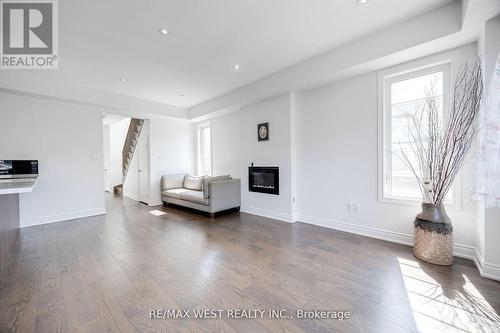 Upper - 2 Augustus Terrace, Toronto (Islington-City Centre West), ON - Indoor Photo Showing Living Room With Fireplace