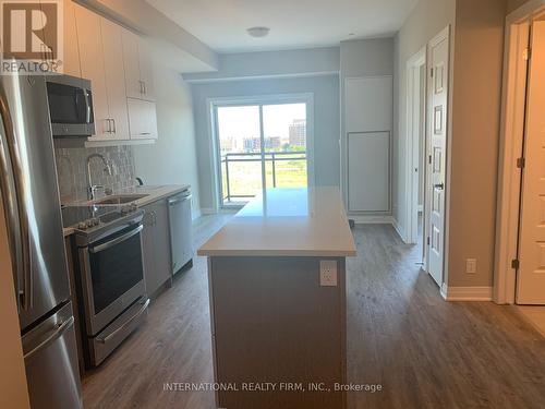 520 - 128 Grovewood Common, Oakville (Uptown Core), ON - Indoor Photo Showing Kitchen With Stainless Steel Kitchen