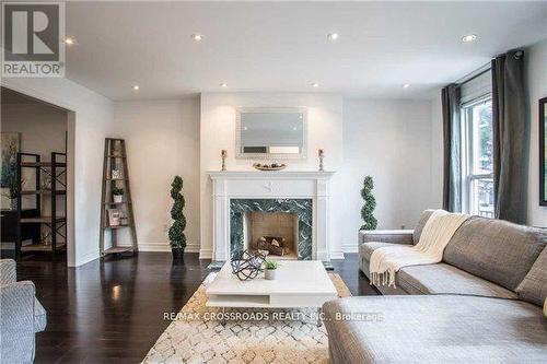 4 Mallingham Court, Toronto, ON - Indoor Photo Showing Living Room With Fireplace