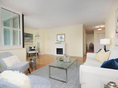 2005-75 Wynford Hts Cres, Toronto, ON - Indoor Photo Showing Living Room With Fireplace