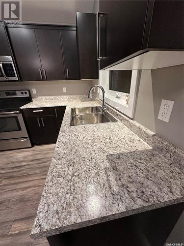 335 Labine Crescent, Saskatoon, SK - Indoor Photo Showing Kitchen With Double Sink