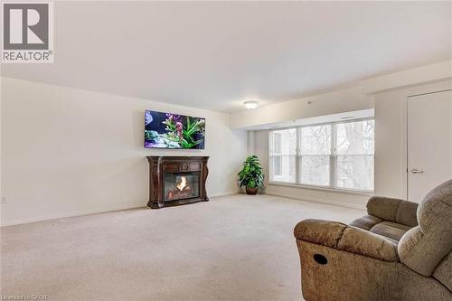 8 Huron Street Unit# 311, Lindsay, ON - Indoor Photo Showing Living Room With Fireplace