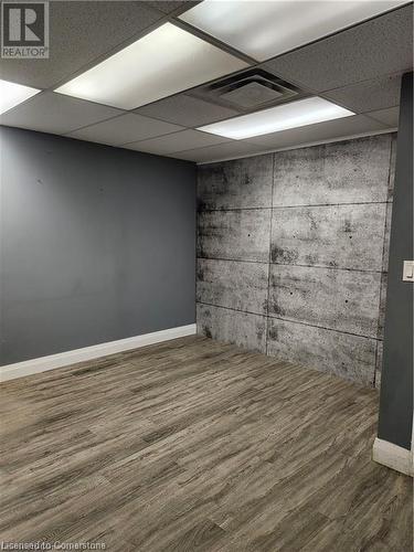 Basement with a paneled ceiling and dark wood-type flooring - 26 Elmwood Avenue, Cambridge, ON 