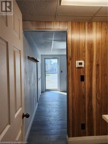 Hallway featuring a paneled ceiling and dark hardwood / wood-style flooring - 26 Elmwood Avenue, Cambridge, ON 