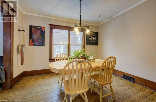 Dining room featuring light wood-type flooring and crown molding - 97 Peppler Street, Waterloo, ON - Indoor Photo Showing Dining Room