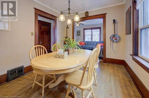 Dining space with ceiling fan, hardwood / wood-style flooring, and ornamental molding - 97 Peppler Street, Waterloo, ON - Indoor Photo Showing Dining Room