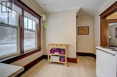 Recreation room featuring ornamental molding and light hardwood / wood-style floors - 97 Peppler Street, Waterloo, ON - Indoor Photo Showing Other Room