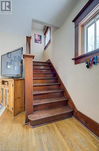 Staircase with hardwood / wood-style flooring - 97 Peppler Street, Waterloo, ON - Indoor Photo Showing Other Room