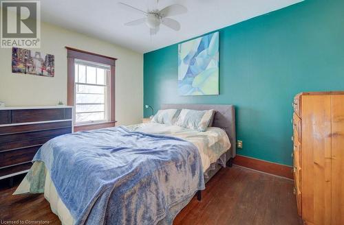 Bedroom with ceiling fan and dark hardwood / wood-style floors - 97 Peppler Street, Waterloo, ON - Indoor Photo Showing Bedroom