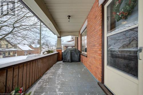 Snow covered patio with area for grilling - 97 Peppler Street, Waterloo, ON - Outdoor With Exterior