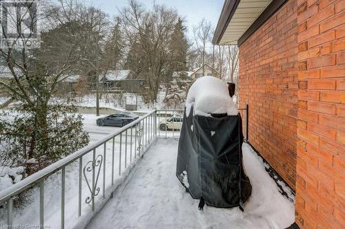 View of snow covered back of property - 97 Peppler Street, Waterloo, ON - Outdoor With Balcony With Exterior