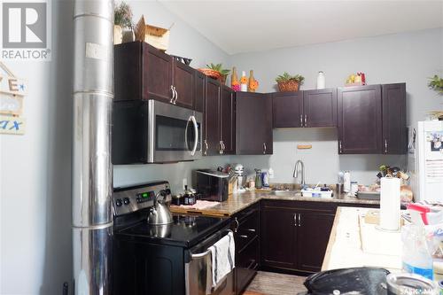21 3Rd Street E, Willow Bunch, SK - Indoor Photo Showing Kitchen With Double Sink