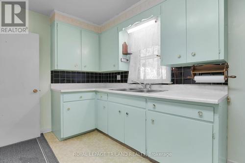 DOUBLE SINK OVERLOOKING BACKYARD - 1399 Beckworth Avenue, London, ON - Indoor Photo Showing Kitchen With Double Sink